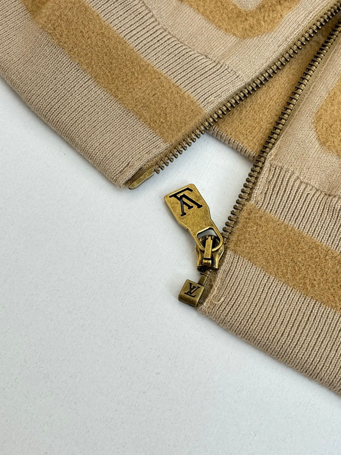 Long knit sweater with front zipper and gold LV logo charm
