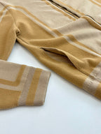 Louis Vuitton beige sleeve knit with gold stripe pattern and ribbed cuff
