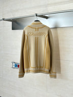 Beige knit zip jacket with Louis Vuitton logo on back and ribbed cuffs