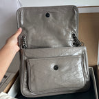 Silver leather mini bag with two front compartments and chain strap hardware