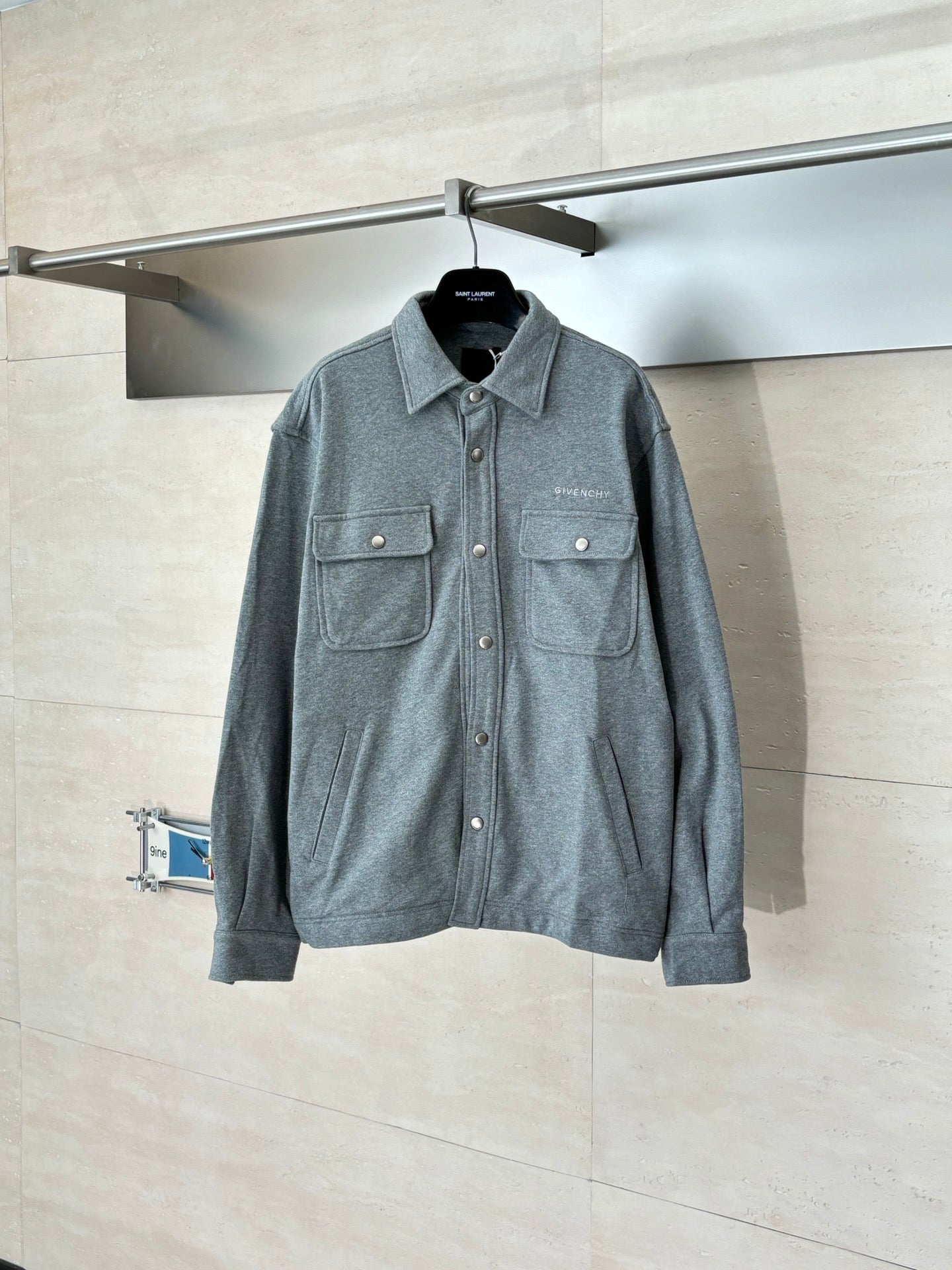 Givenchy gray button-up jacket with flap pockets and metal snap buttons