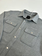 Gray Givenchy button-up jacket with two front flap pockets and snap buttons