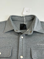 Gray Givenchy jacket collar with snap buttons and chest pocket detailing