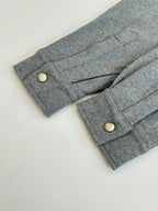 Gray Givenchy jacket cuffs with snap buttons and front placket panel