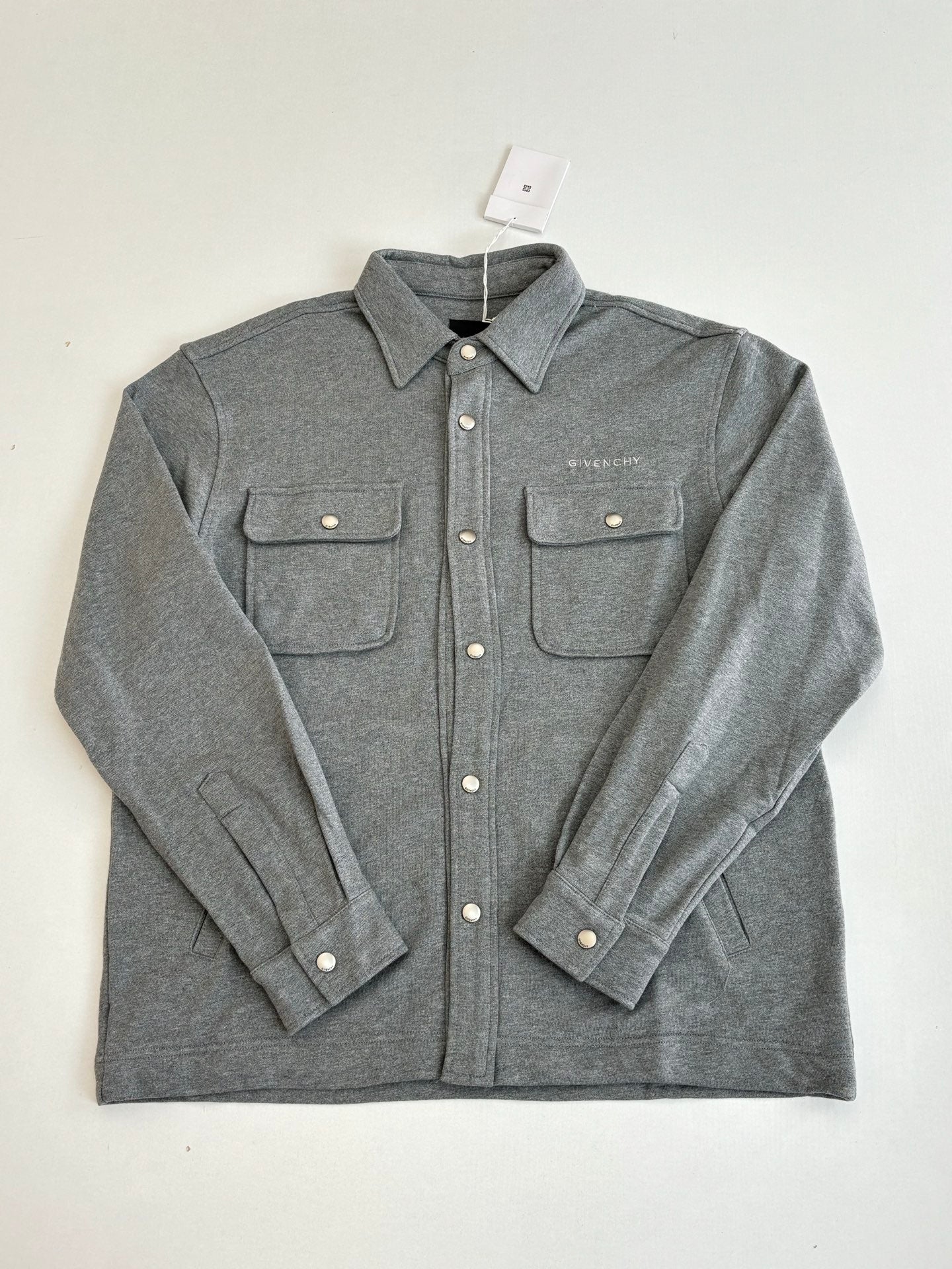 Gray Givenchy button-up jacket with flap chest pockets and snap buttons