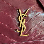 Saint Laurent YSL logo on burgundy quilted leather flap with gold hardware