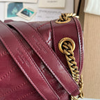 Saint Laurent quilted burgundy bag with gold chain strap and flap corner
