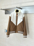 Louis Vuitton long jacket with brown sleeves, white panels, and front zipper