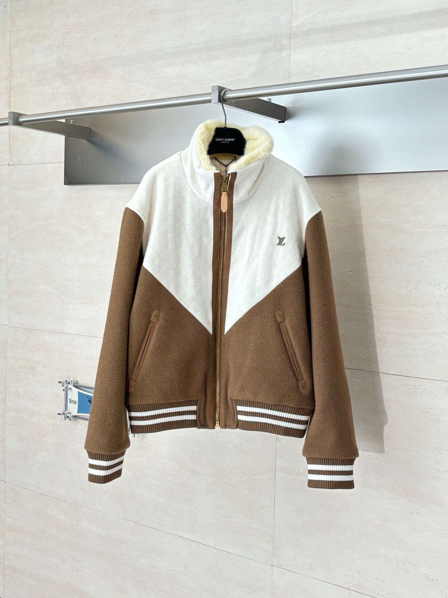 Louis Vuitton long jacket with brown sleeves, white panels, and front zipper