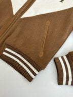 Louis Vuitton long jacket sleeve and stripe cuff with front zip and leather logo patch