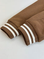 Louis Vuitton long-sleeve top, brown ribbed cuffs with two white stripe bands