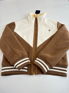 Louis Vuitton long jacket close-up with front zipper, tan-brown fleece, striped cuffs