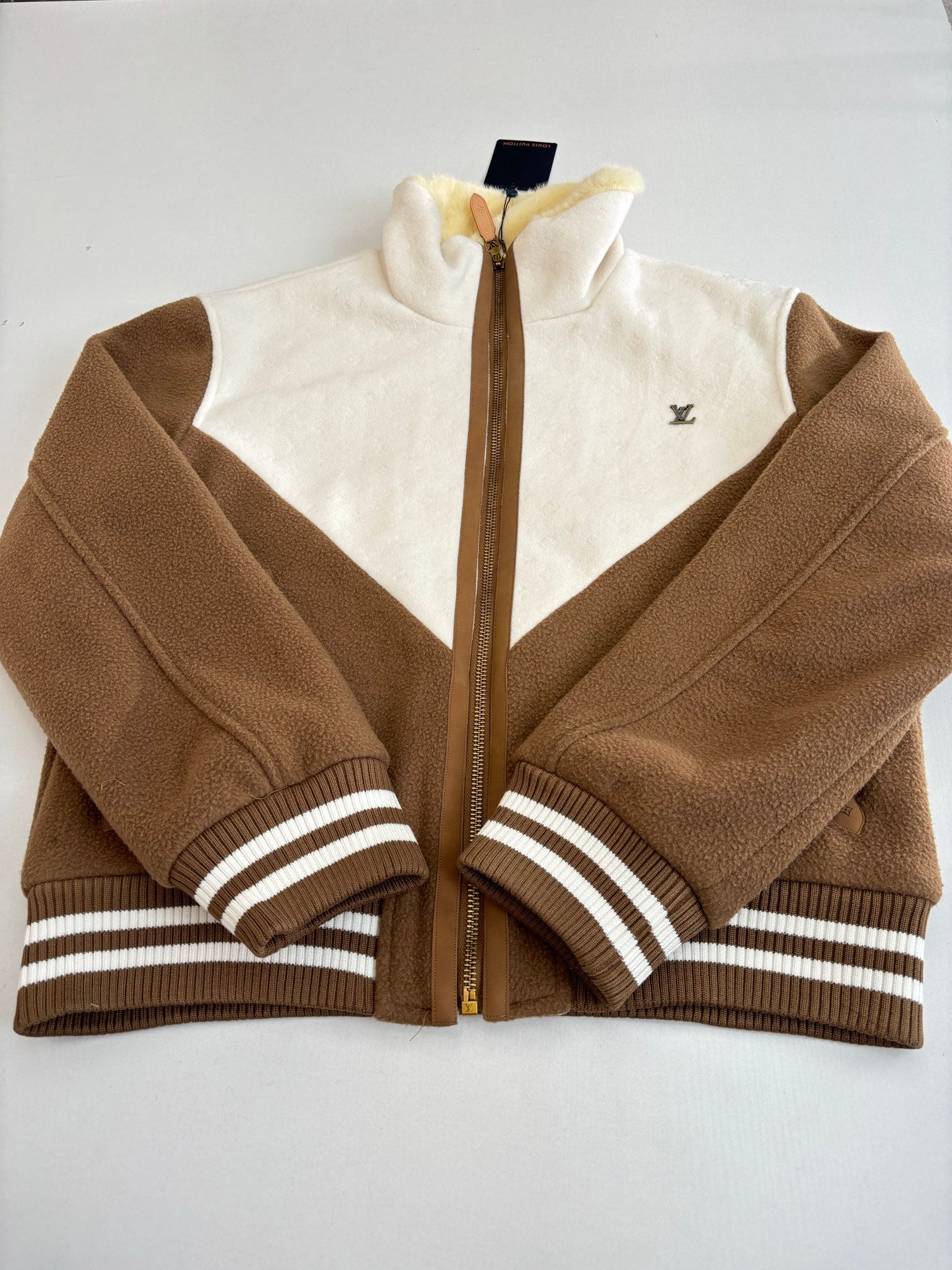 Louis Vuitton long jacket close-up with front zipper, tan-brown fleece, striped cuffs