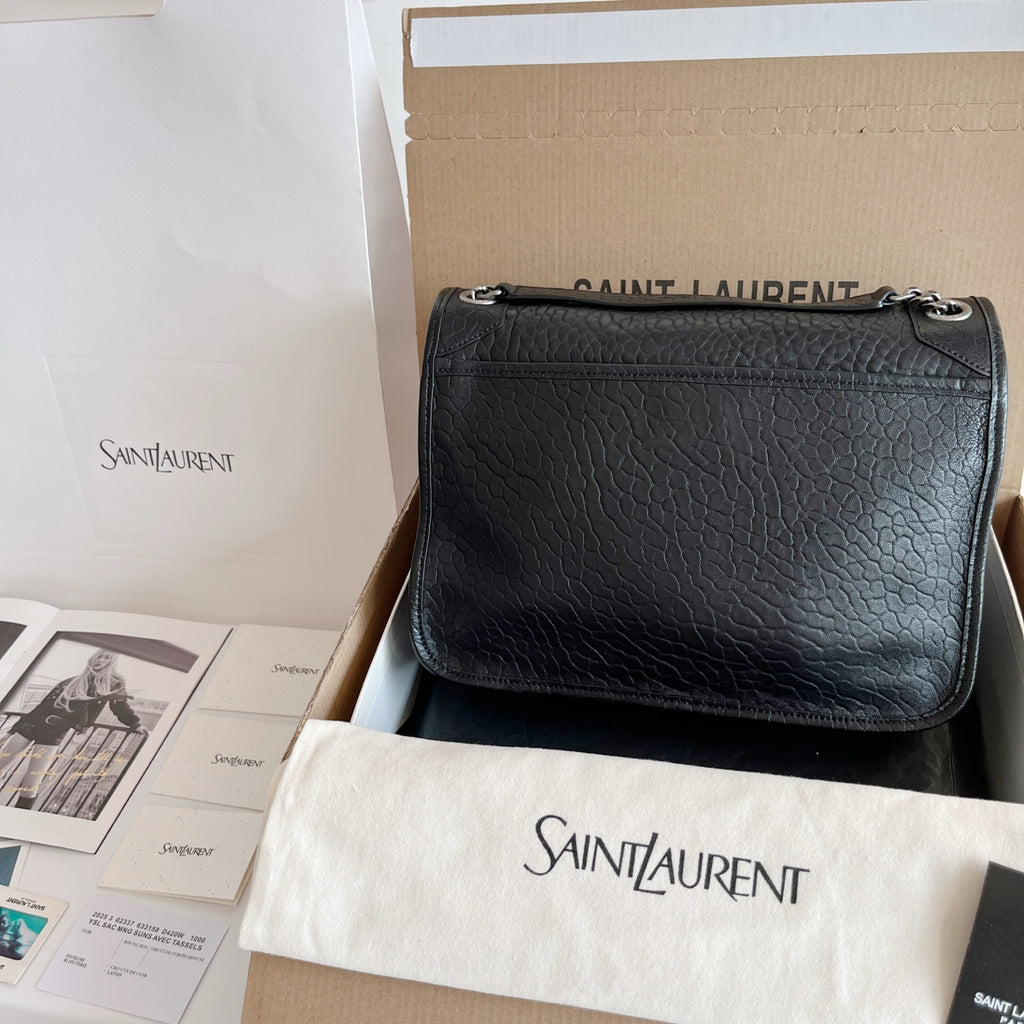 YSL bag in black textured leather with flap and silver chain strap, front view