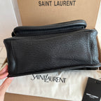 YSL bag back panel in black textured leather, folded flap edge, minimal branding