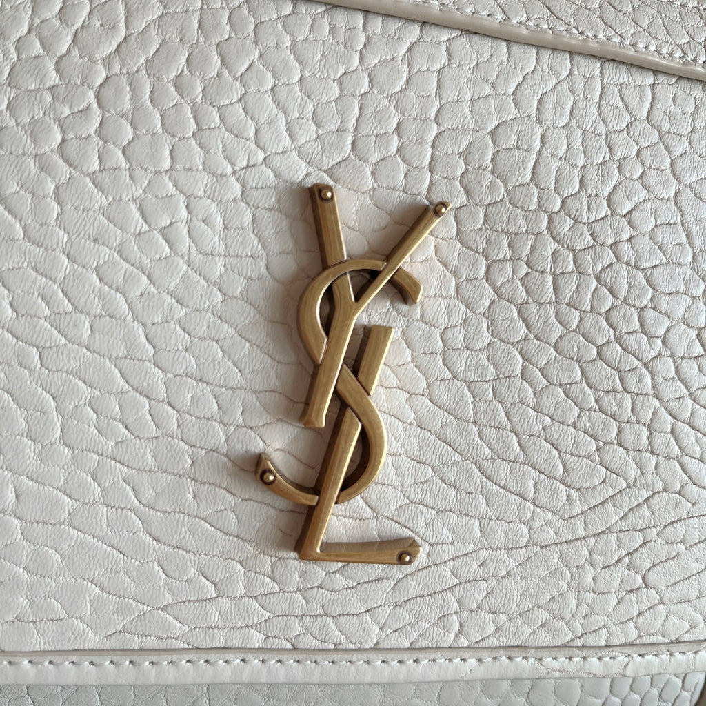 YSL bag front YSL logo in gold-tone on white textured leather