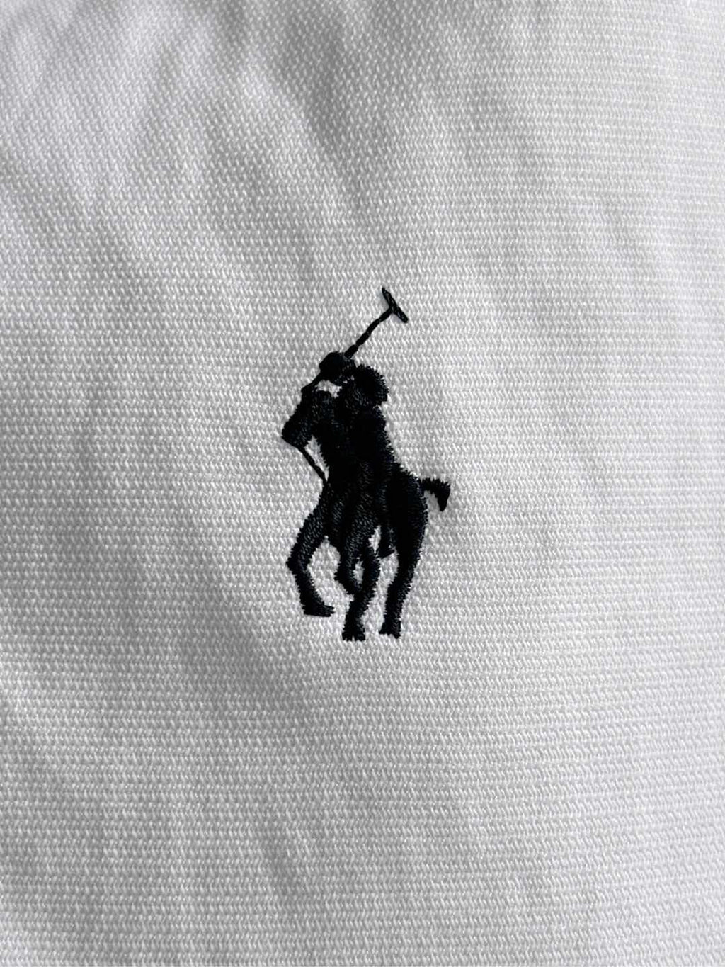 Black Polo horse logo on white fabric