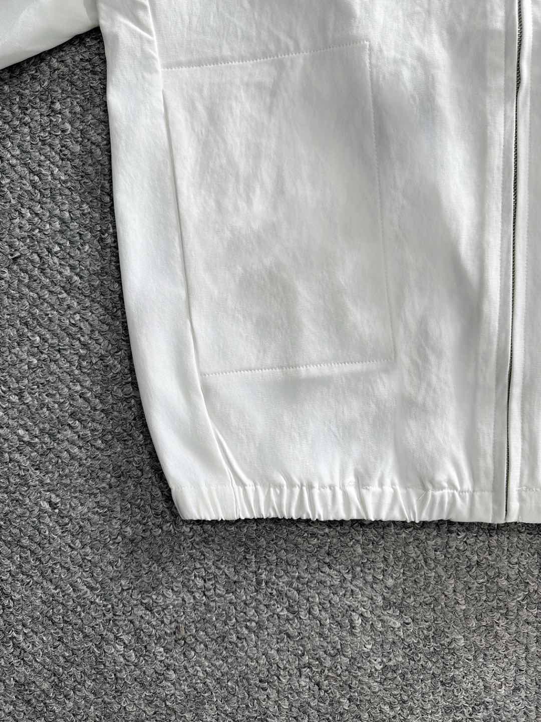 White jacket front panel with zipper and elastic hem
