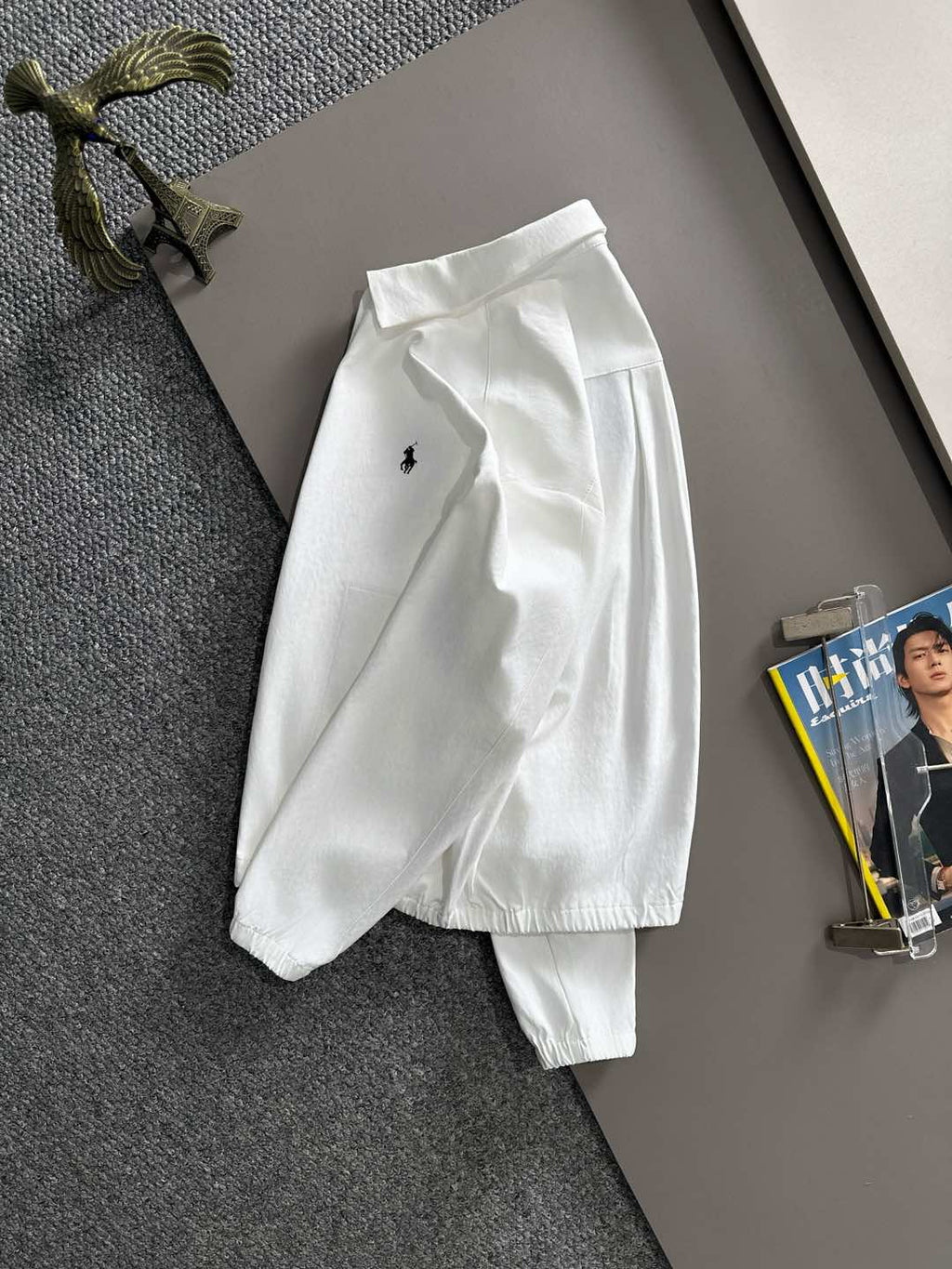 White jacket with small Polo horse logo, long sleeves