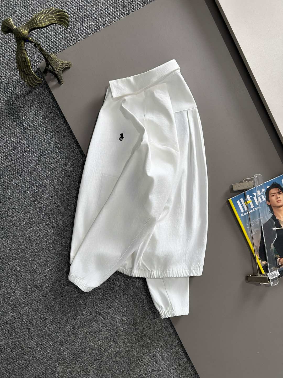 White jacket with small Polo horse logo, long sleeves