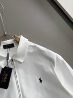 White zip jacket with small black Polo horse logo