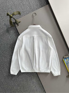 White zip jacket back view on hanger, long sleeves