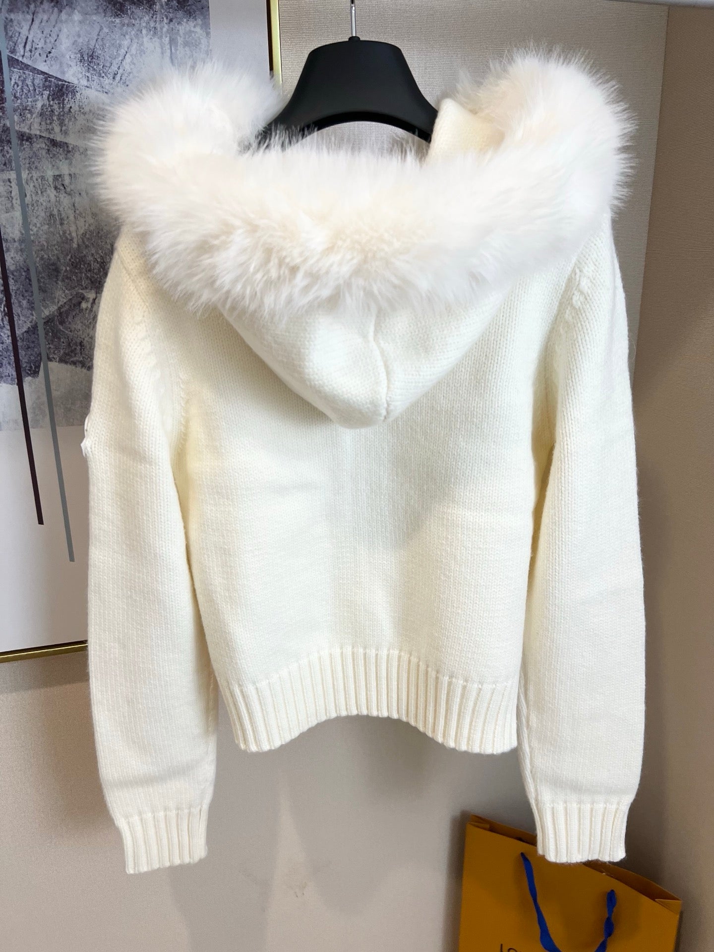 Moncler long knit zip sweater back view with faux-fur hood