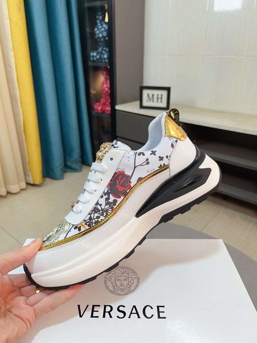Versace sneakers, white upper with gold-edged side graphic and black sole, lace-up