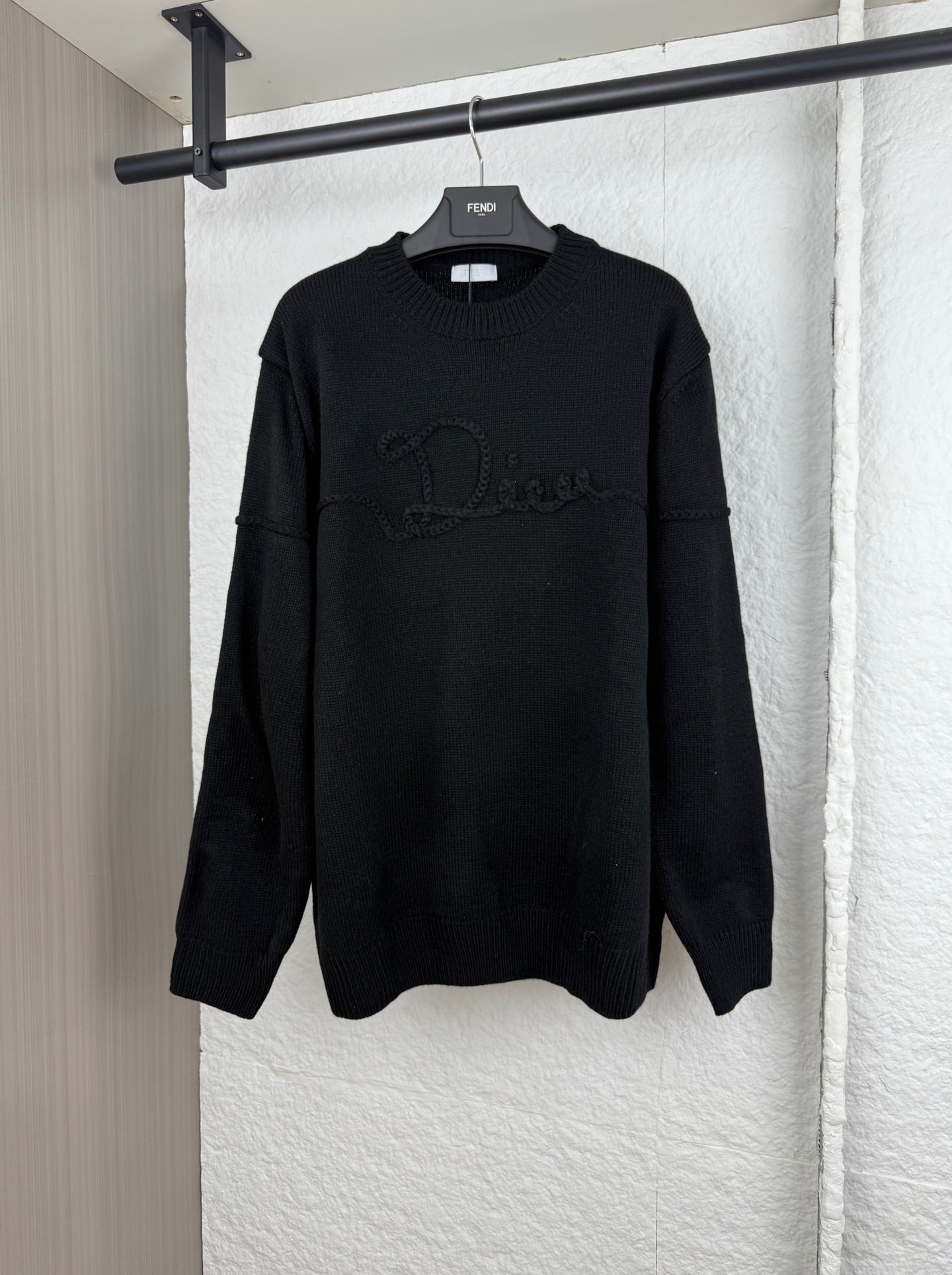 Dior long-sleeve knit sweater in black with front logo graphic