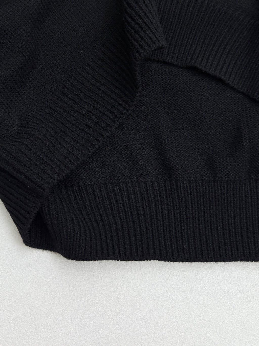 Dior black knit sweater hem with ribbed band cuff