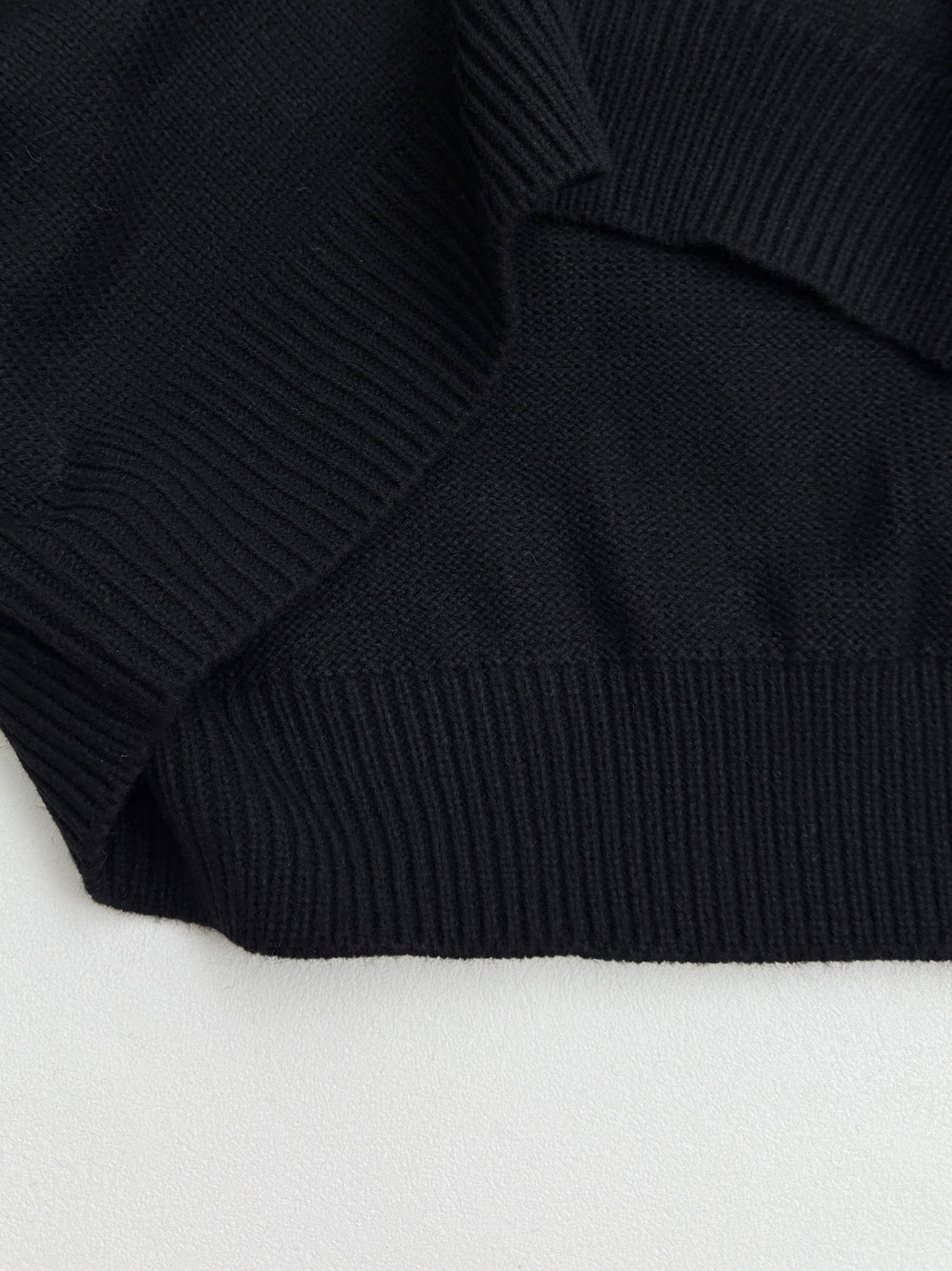 Dior black knit sweater hem with ribbed band cuff