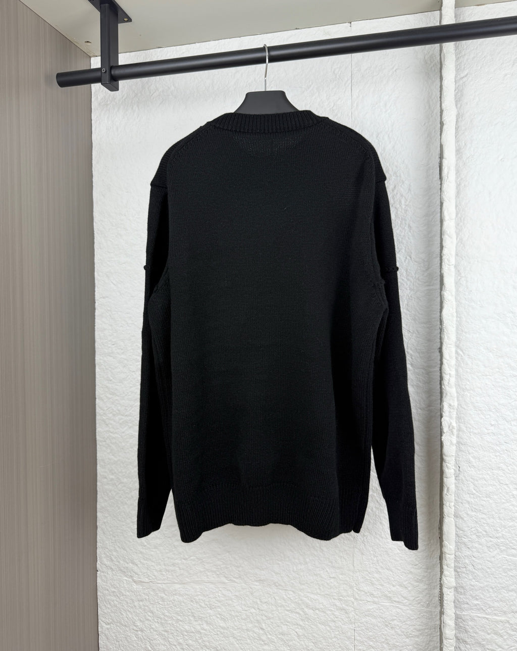 Dior long-sleeve knit sweater in black, back view with ribbed crew neckline