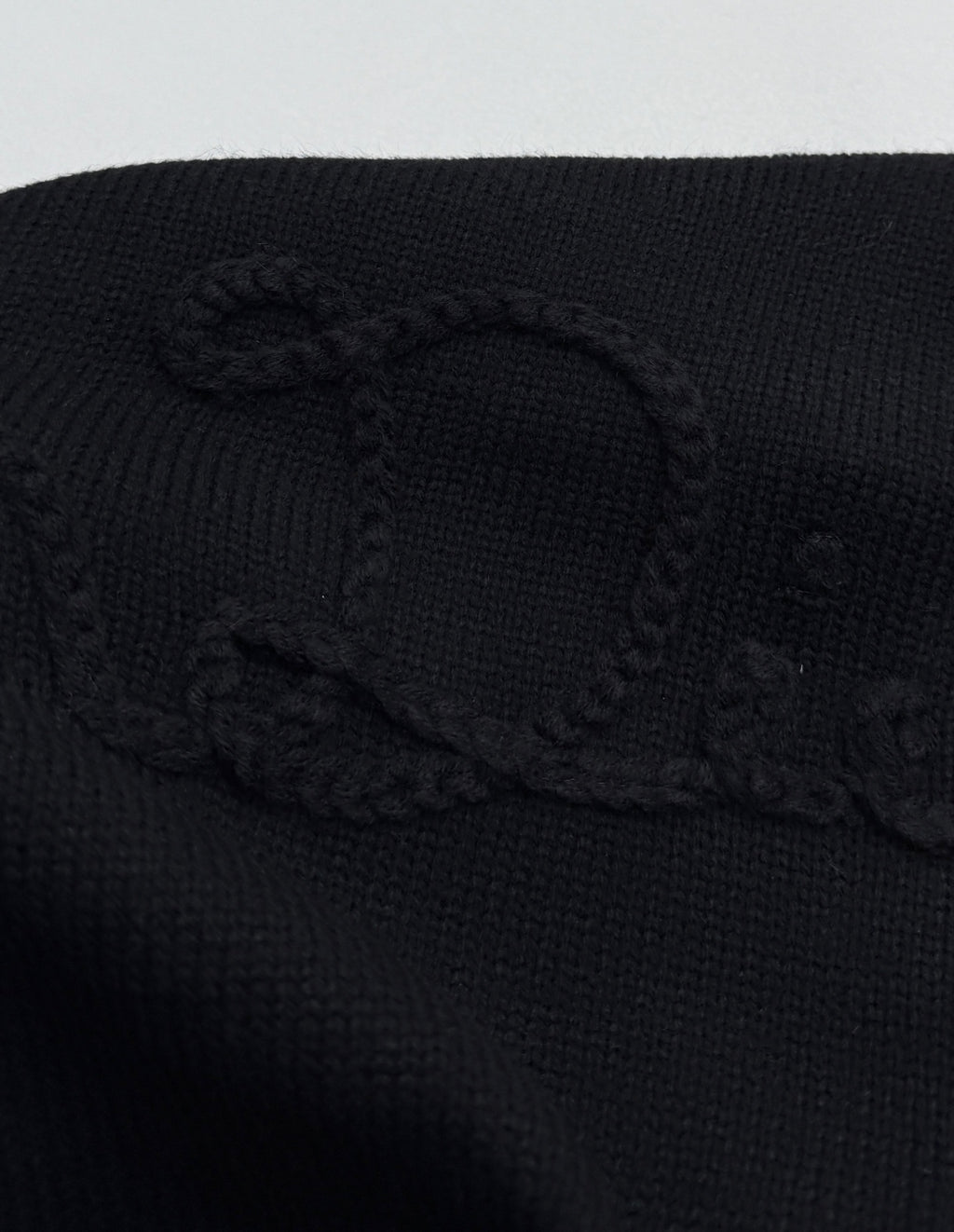 Dior black knit sweater with textured logo graphic on the chest