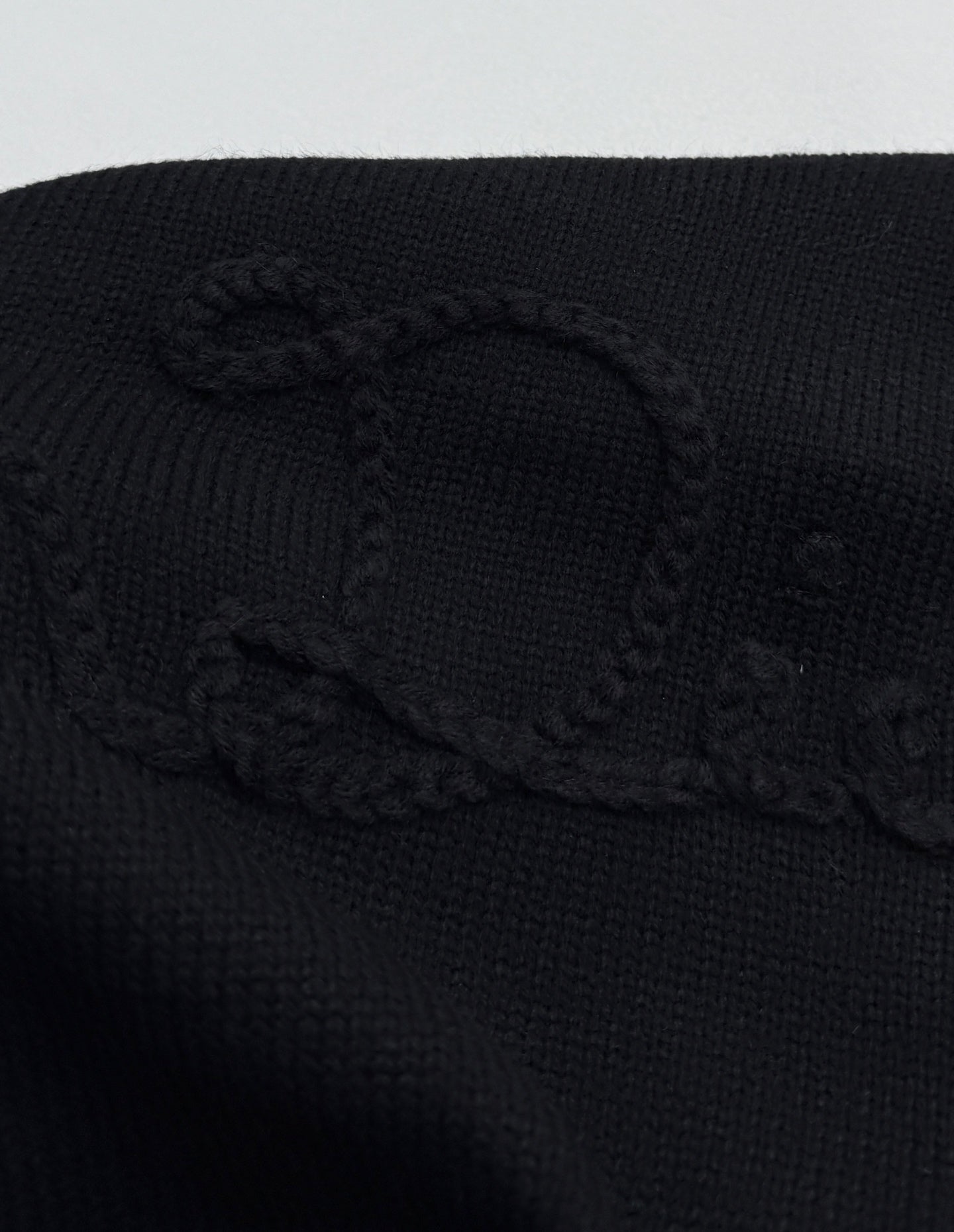 Dior black knit sweater with textured logo graphic on the chest