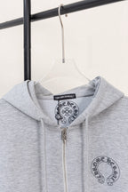 Grey zip hoodie with hood and chest graphic under the neckline.