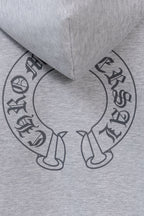 Heather gray zip-up hoodie neck area with circular graphic