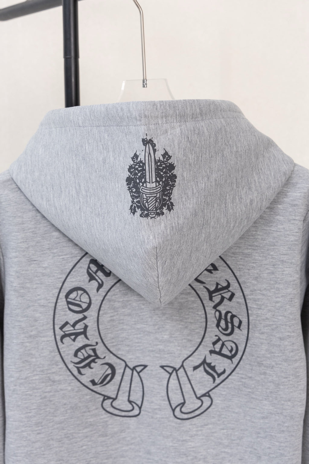 Heather gray zip-up hoodie hood with crest graphic
