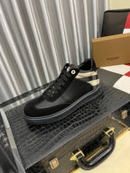Black low-top sneaker with check-panel collar and black lace-up design