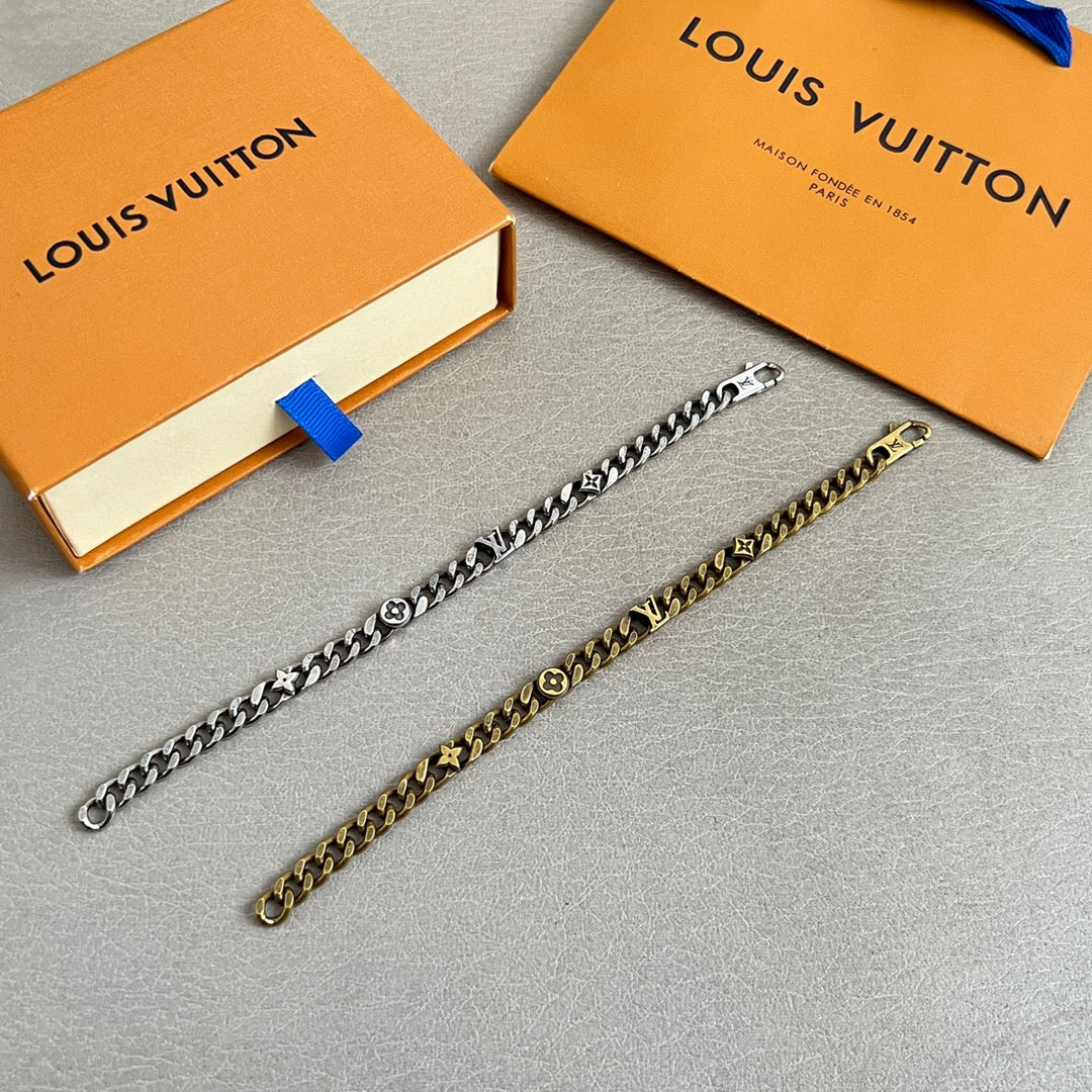 Gold-tone chain bracelet with Louis Vuitton logo charms and clasp