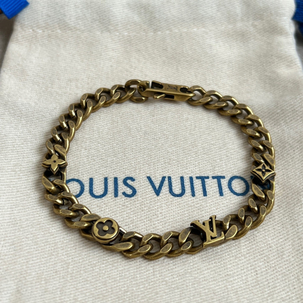 Gold-tone chain bracelet with monogram charms and small link details