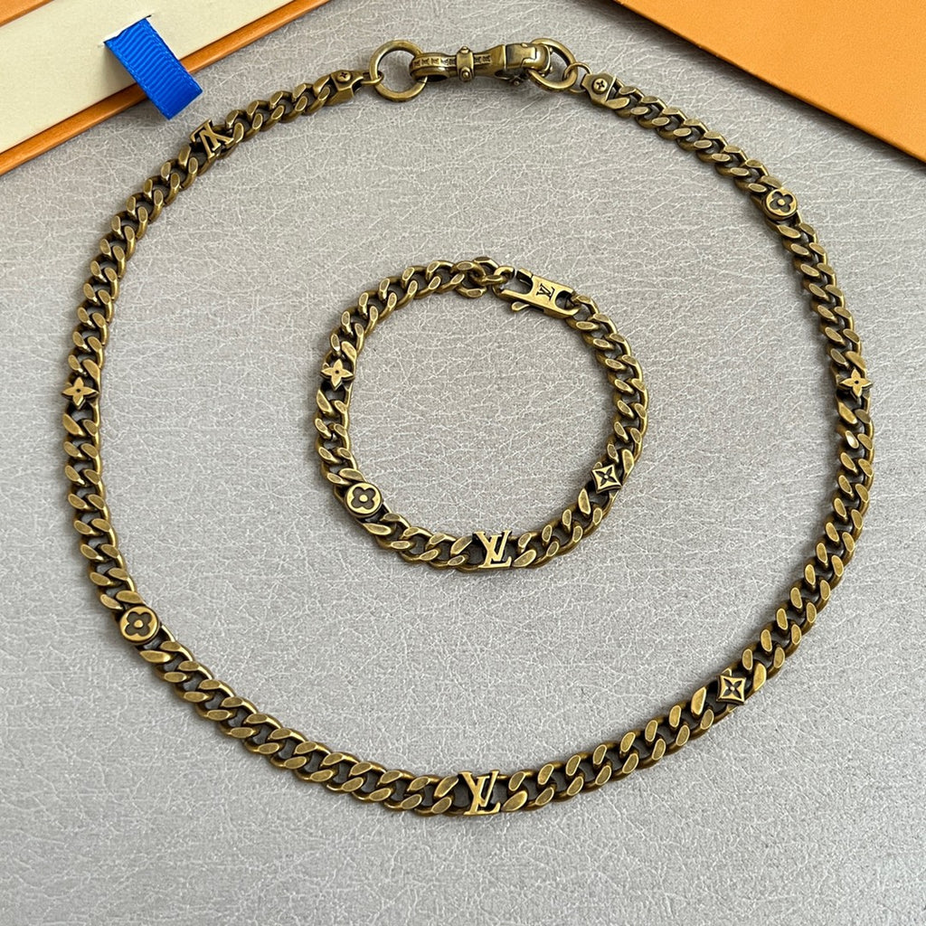 Gold-tone chain necklace and bracelet with monogram charms
