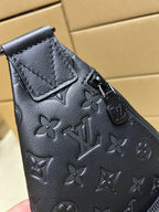 Men's Louis Vuitton monogram leather bag, dark blue/black, top corner with strap hardware