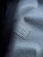 Men's Louis Vuitton monogram leather lining tag, dark blue/black, close-up