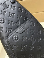 Men's Louis Vuitton monogram leather bag, dark blue/black, embossed pattern close-up