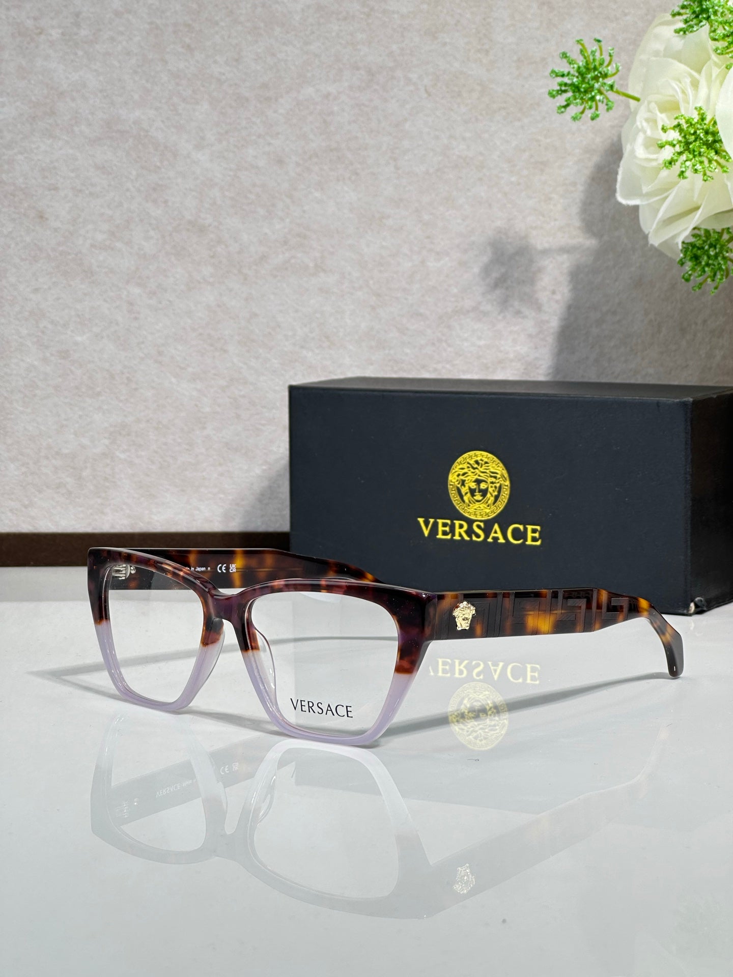 Dark tortoise rectangular eyeglasses with clear lenses and VERSACE logo on temple arms