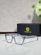 Light blue rectangular eyeglasses with clear lenses and VERSACE logo on temple arms