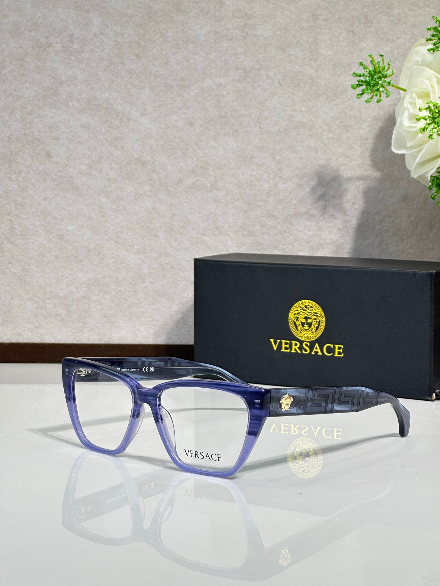Blue gradient rectangular eyeglasses with clear lenses and VERSACE logo on temple arms