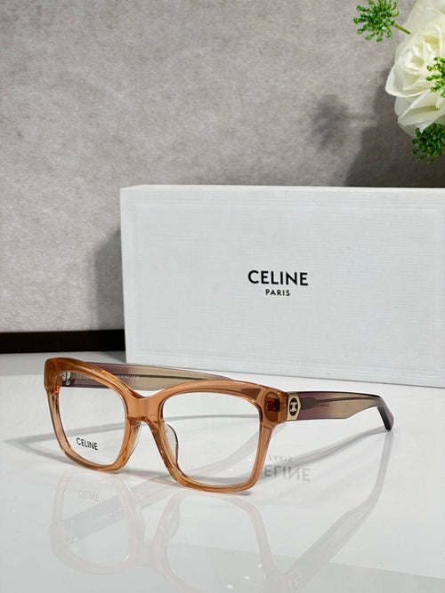 Brown tortoiseshell eyeglass frames with clear lenses and gold-tone logo detail