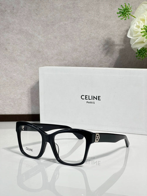 Black eyeglass frames with clear lenses and gold-tone logo at temple