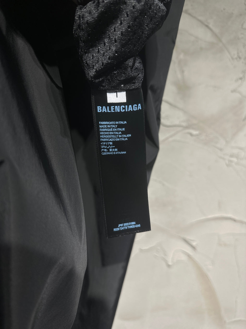 Black pants with inner fabric label tag near waistband
